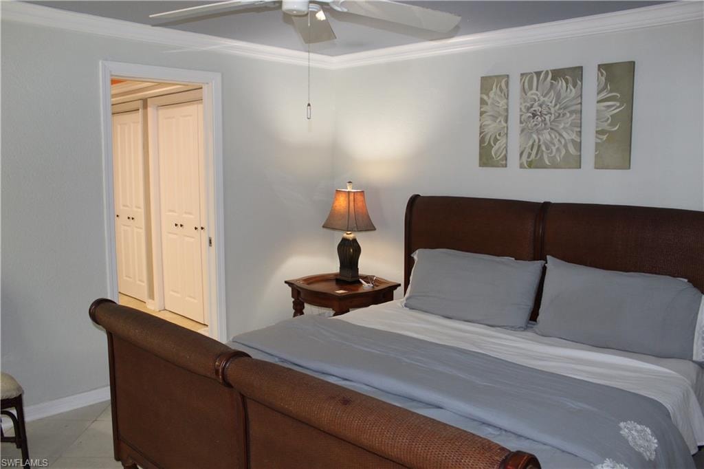 Bedroom featuring crown molding and ceiling fan