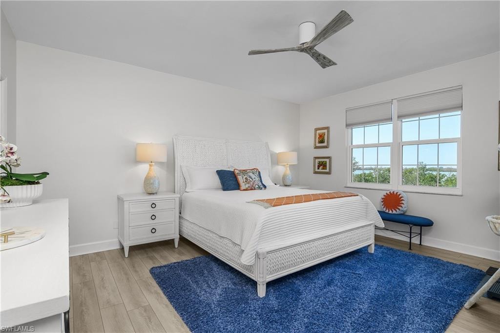 Bedroom featuring light wood-type flooring and a ceiling fan