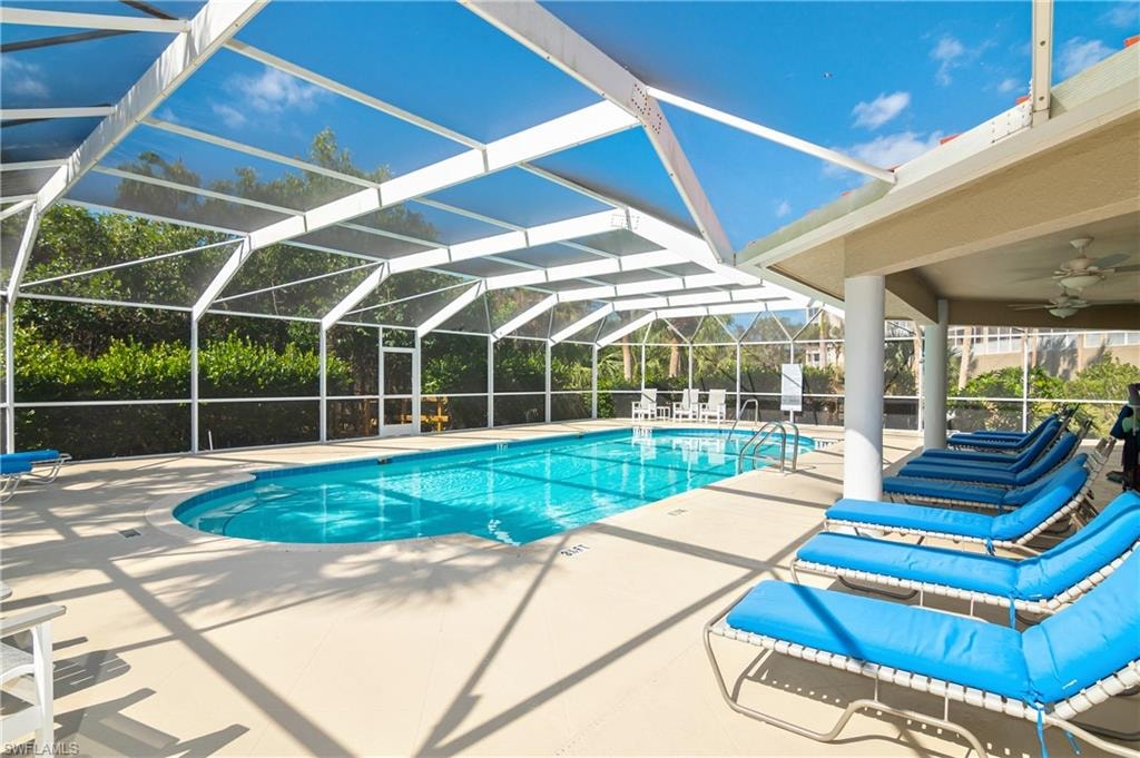 Community pool featuring a patio, a lanai, and a sunroom