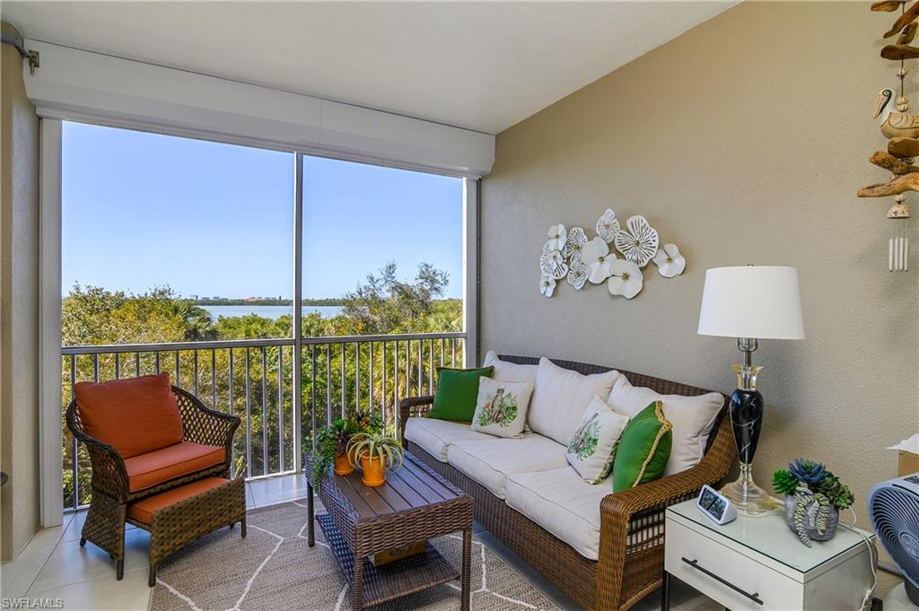 Sunroom / solarium featuring a balcony and outdoor furniture