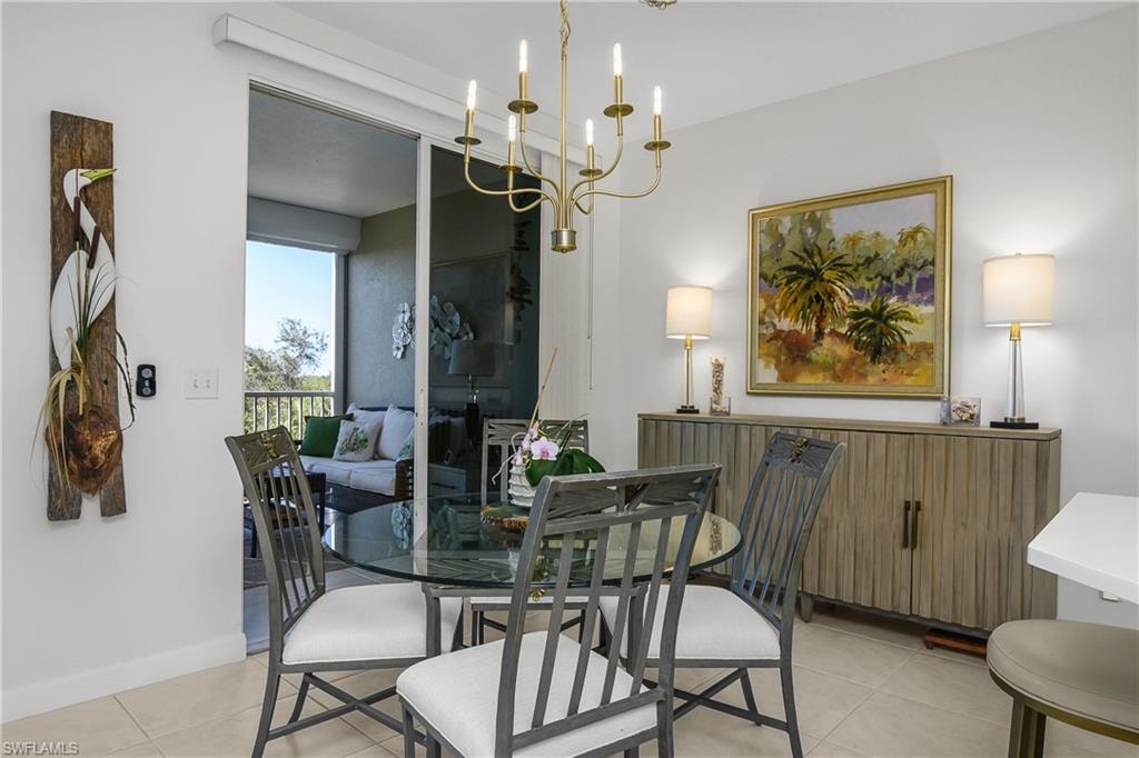 Dining area featuring a chandelier and light tile patterned floors