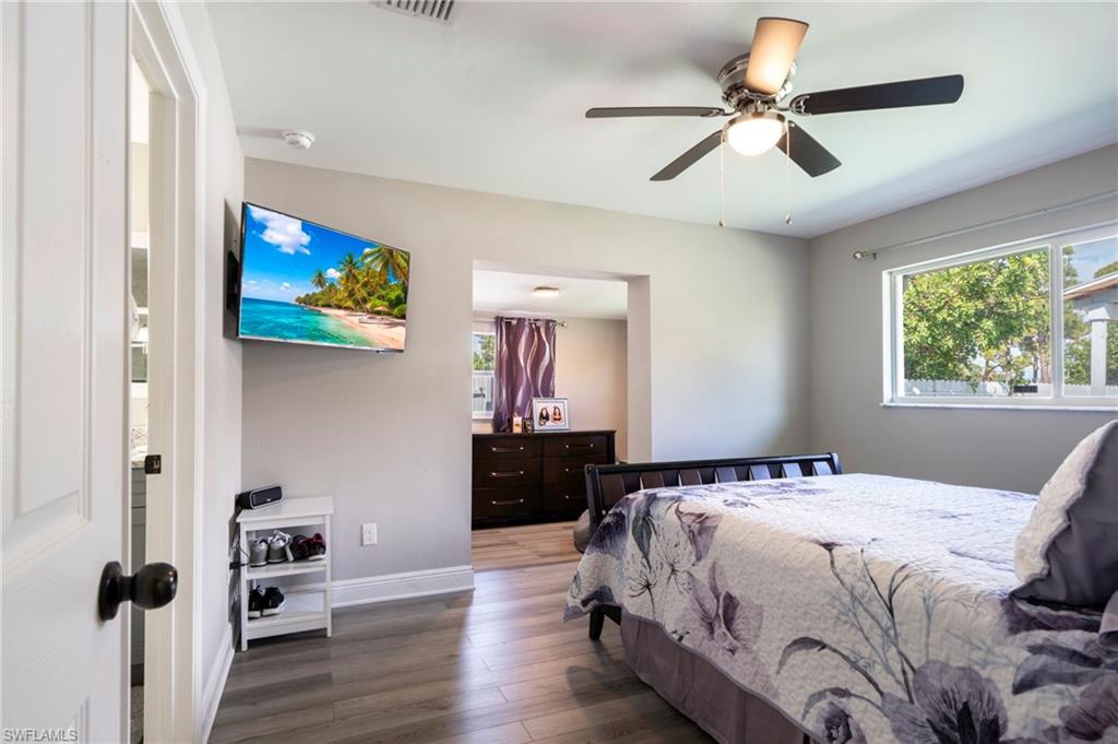 Bedroom featuring hardwood / wood-style floors and a ceiling fan