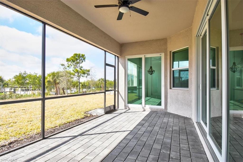 Unfurnished sunroom with a ceiling fan