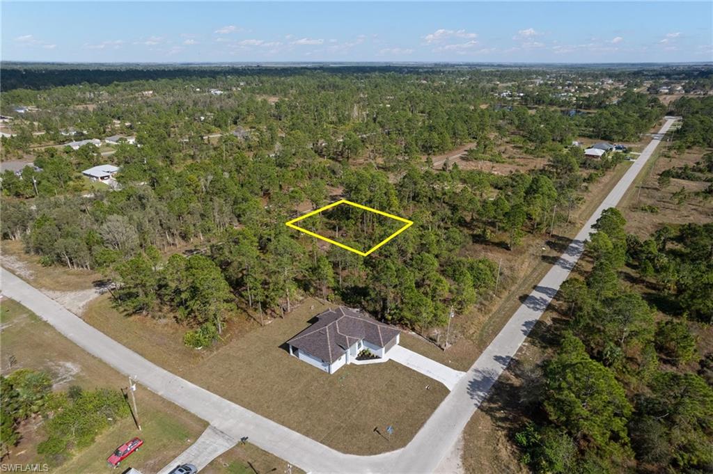 Aerial overview of property's location with a forest and property boundaries highlighted