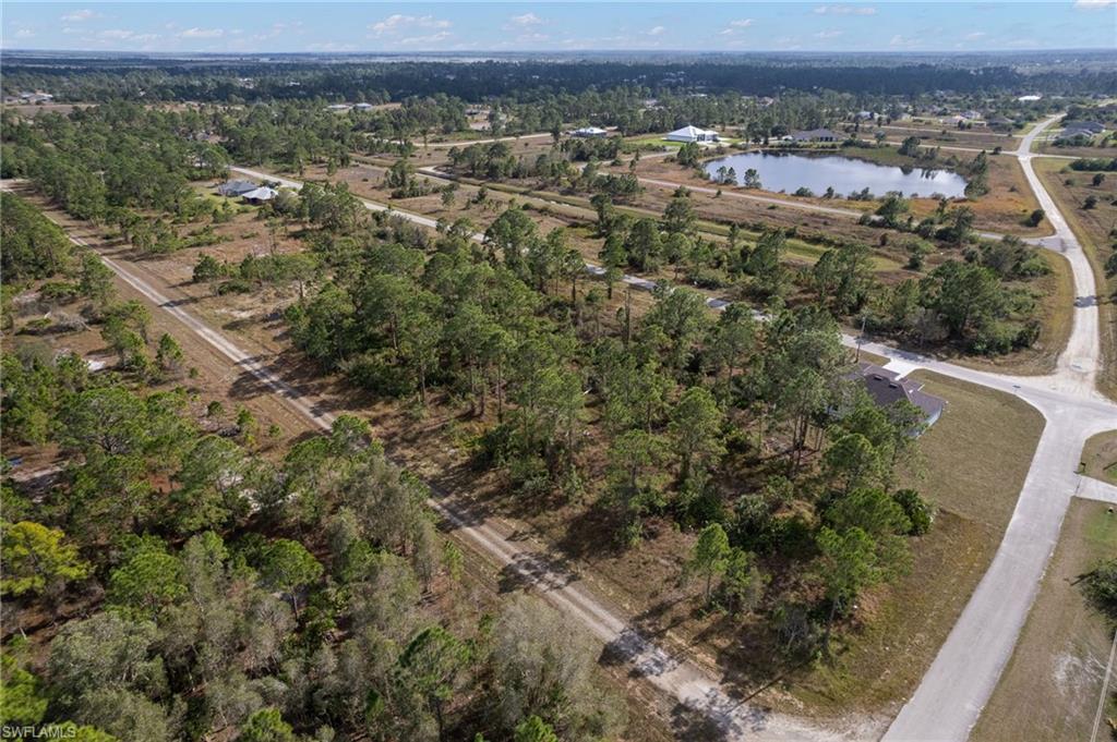 Aerial overview of property's location with a large body of water