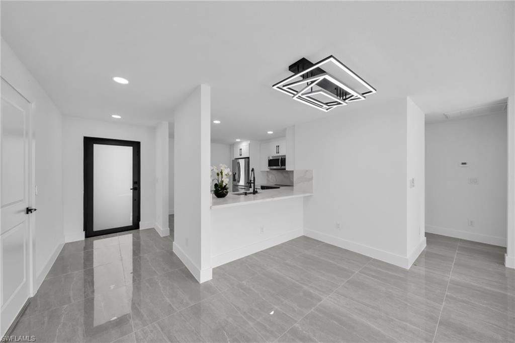 Entryway featuring recessed lighting and baseboards