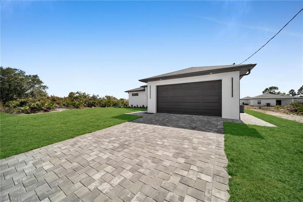Garage with decorative driveway