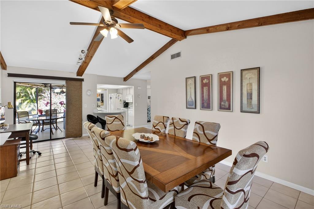 Dining space with ceiling fan and light tile patterned floors