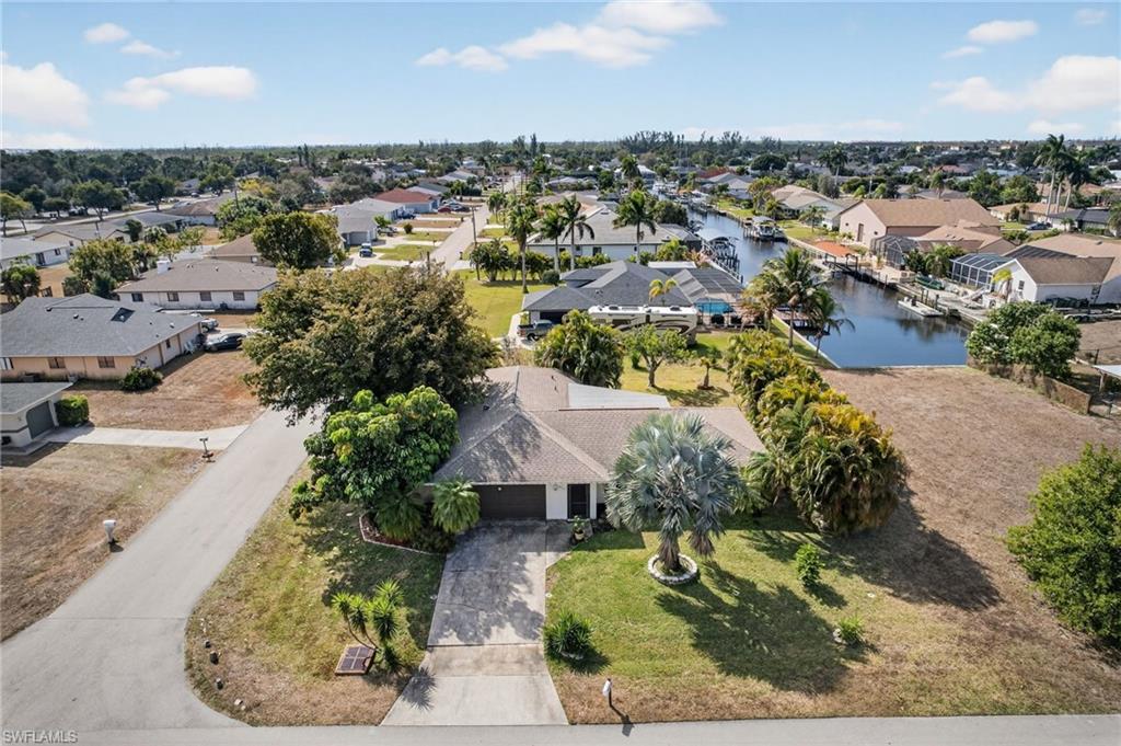 Aerial perspective of suburban area with a large body of water