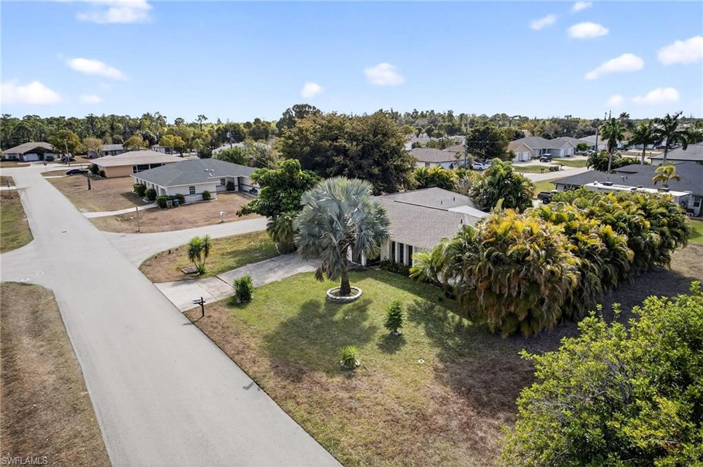 Aerial view of residential area featuring a tree filled landscape