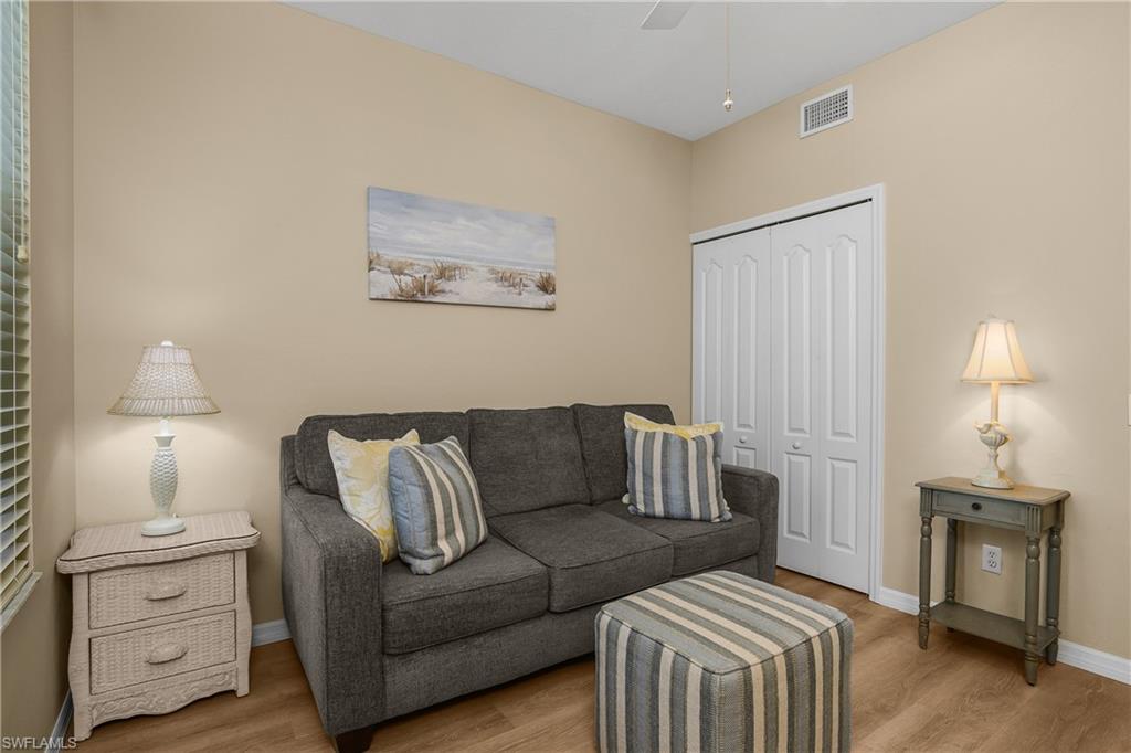Bedroom being used as a den. with a sleeper sofa