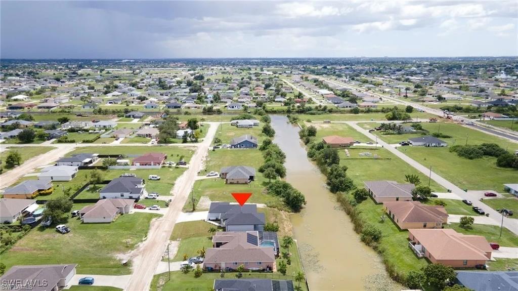 Aerial overview of property's location with nearby suburban area