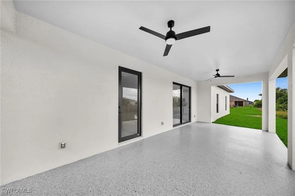 View of patio featuring ceiling fan