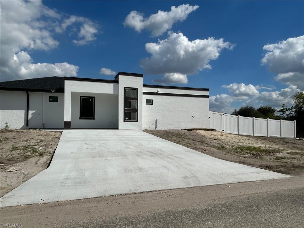 Contemporary home featuring stucco siding