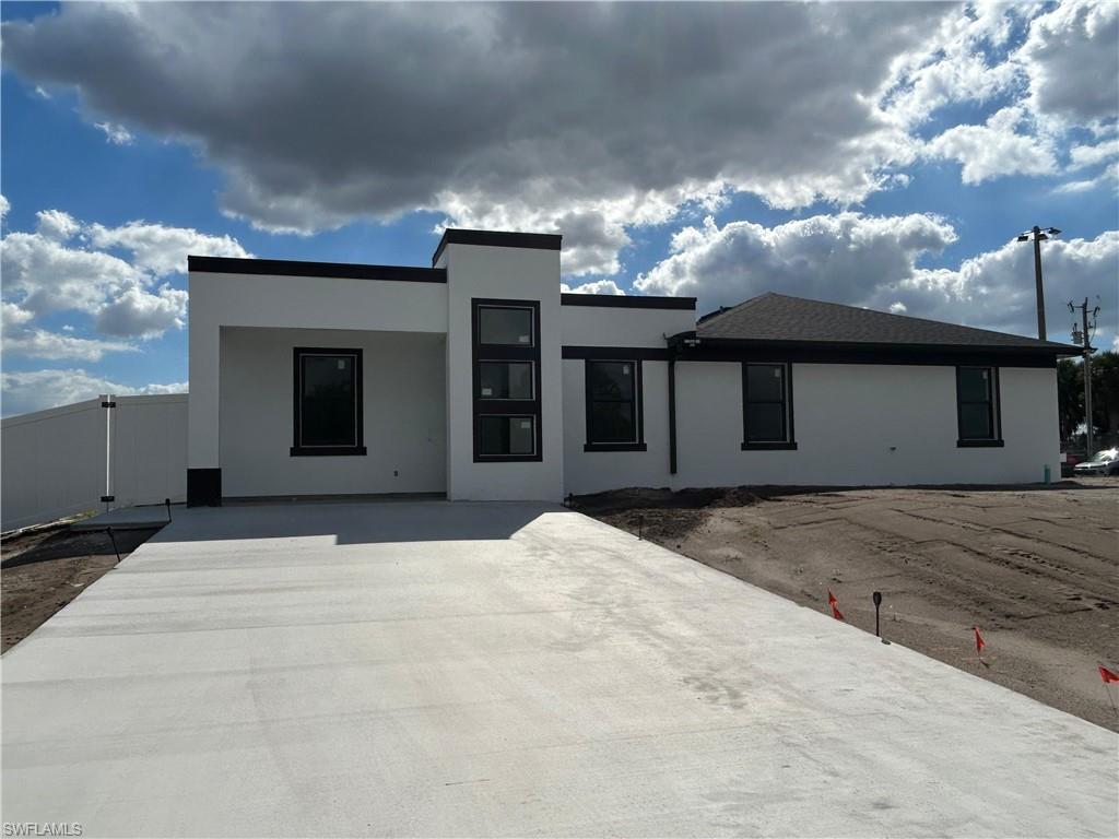 View of front facade with stucco siding