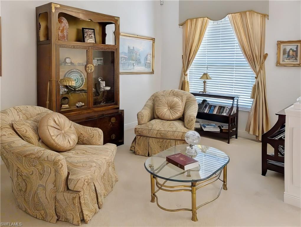 Living area with light carpet