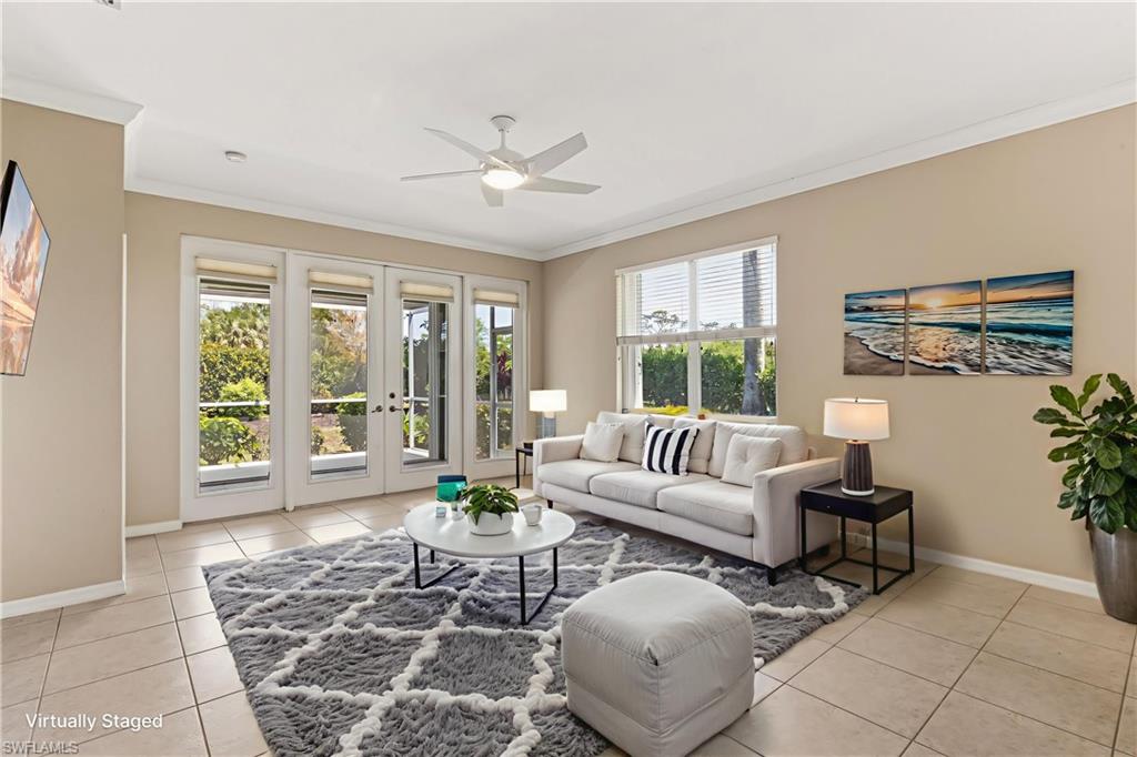 Virtually Staged. Living area featuring neutral wall tones and tile flooring