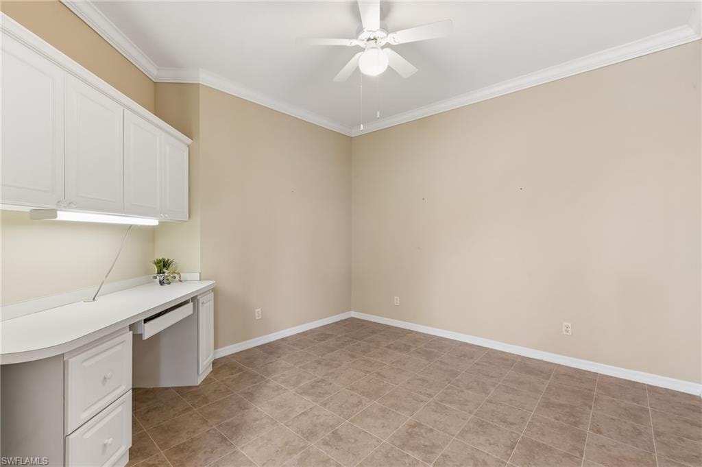 Den - versatile space with built in desk, cabinets. Tile, Crown Molding.