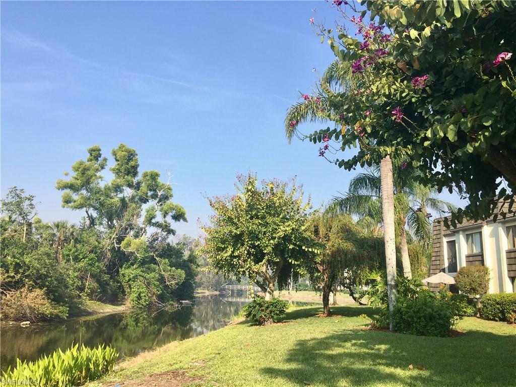 View of green lawn with a water view