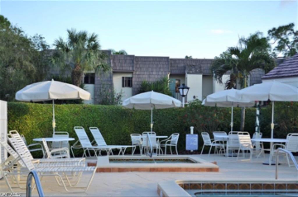 Community pool with outdoor dining area