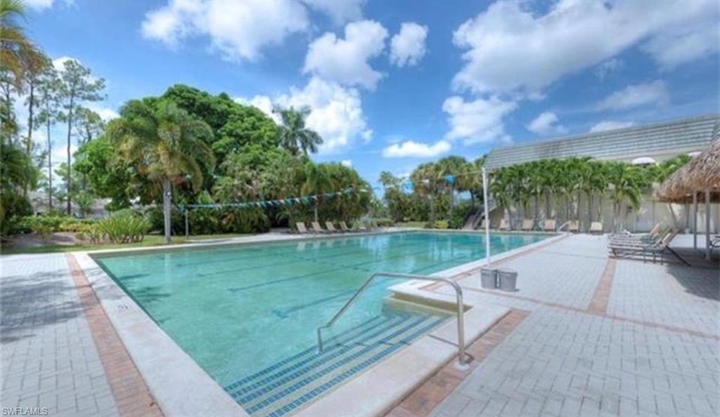 Community pool with a patio