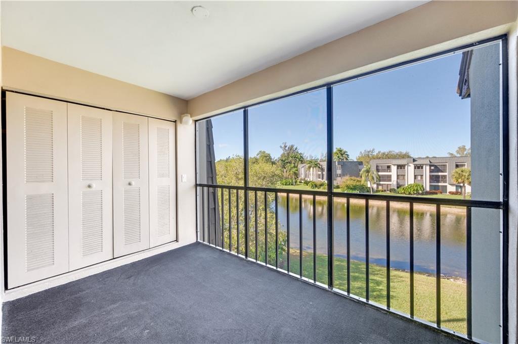 Unfurnished sunroom featuring a water view