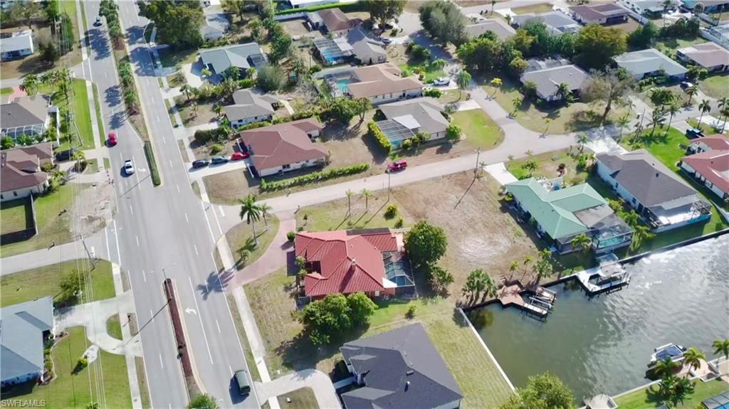 Aerial view of residential area featuring a gulf access canal.r