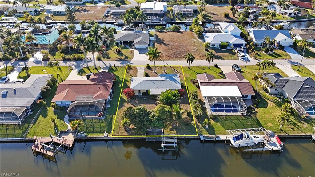 Aerial view of residential area with a large body of water