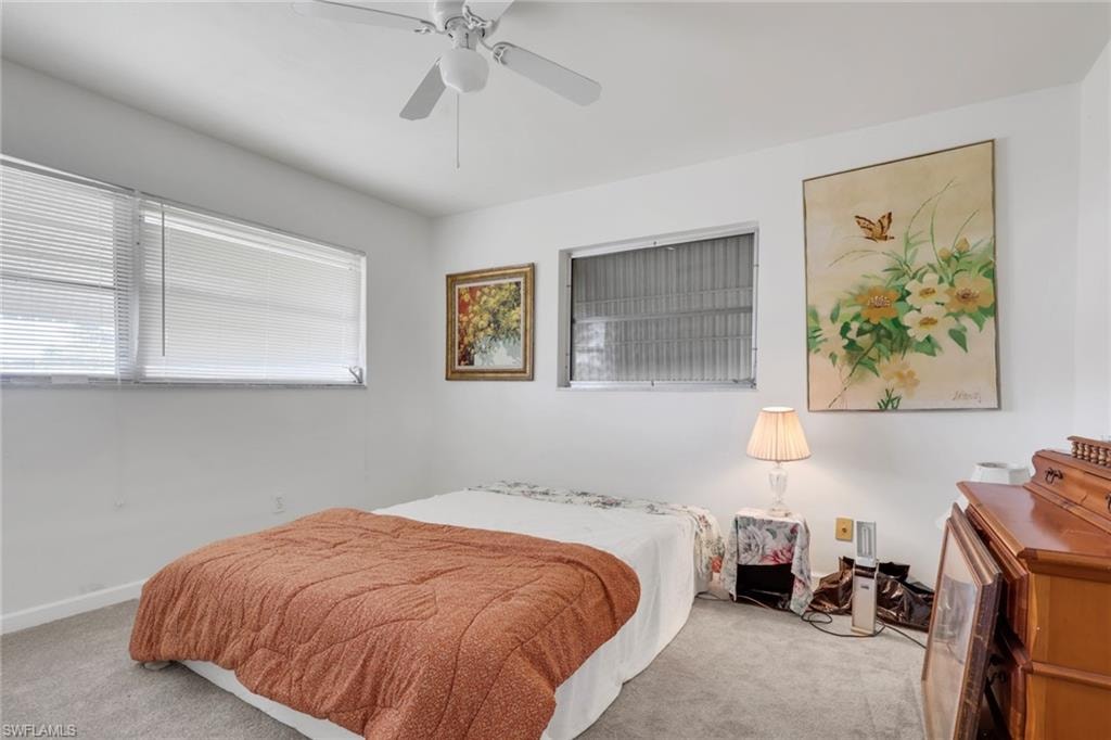 Bedroom with carpet and ceiling fan