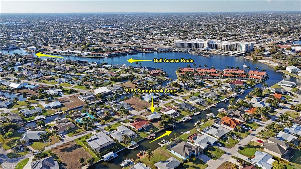 Aerial overview of property's location with a large body of water