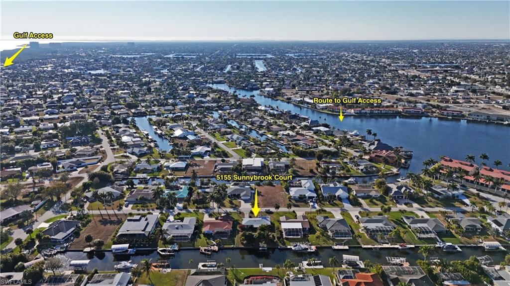 Aerial perspective of suburban area with a large body of water