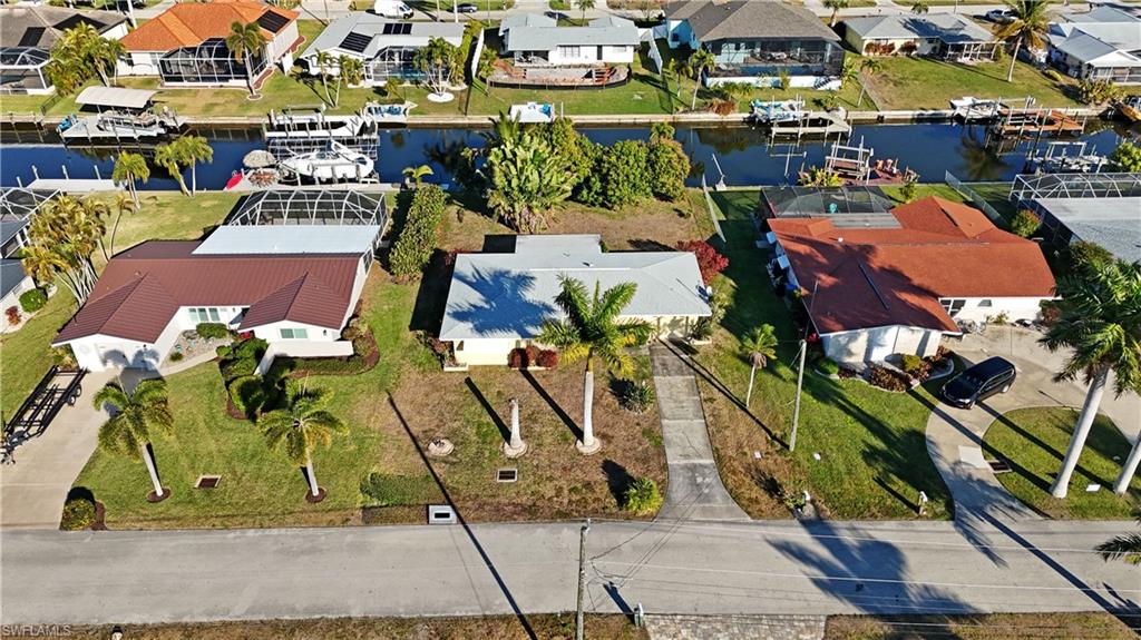 Aerial view of residential area featuring a large body of water