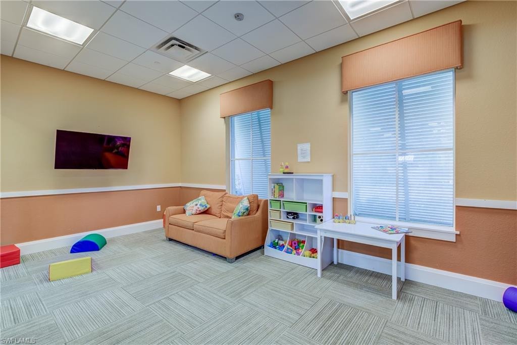 Recreation room with a drop ceiling