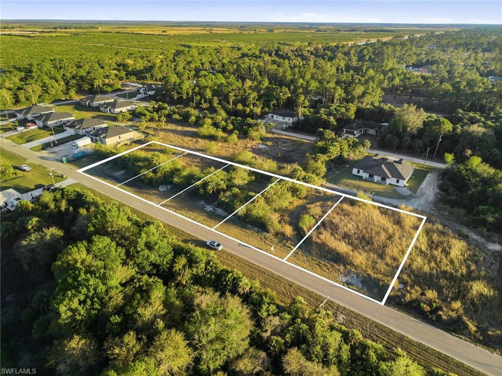 Aerial view of residential area featuring property parcel outlined