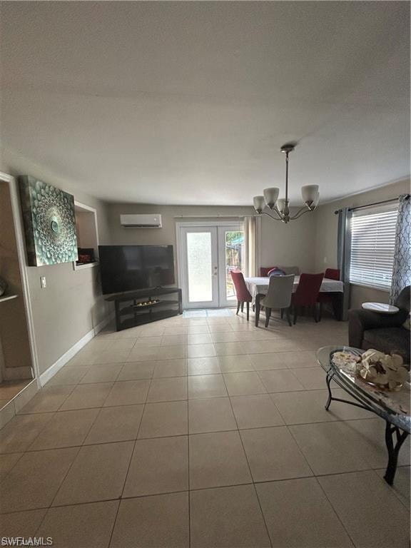 Living room featuring suspended lighting, french doors, and light tile patterned floors