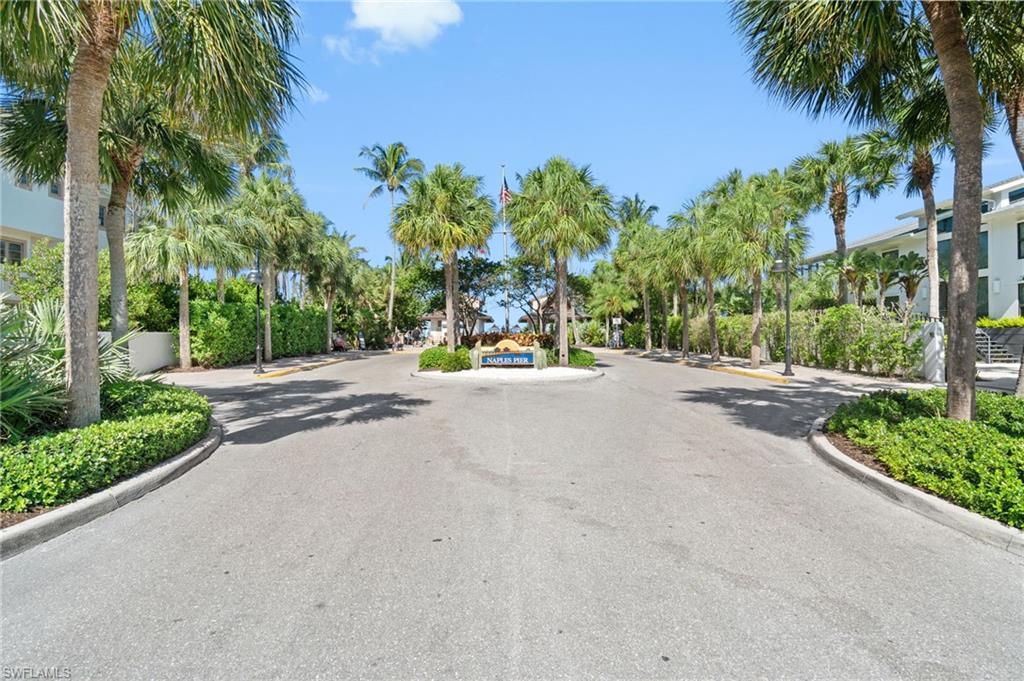 View of asphalt road with curbs