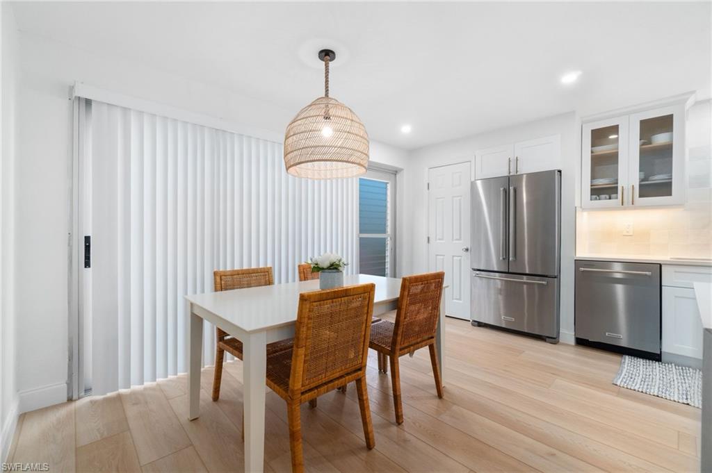 Dining room featuring recessed lighting and light wood finished floors