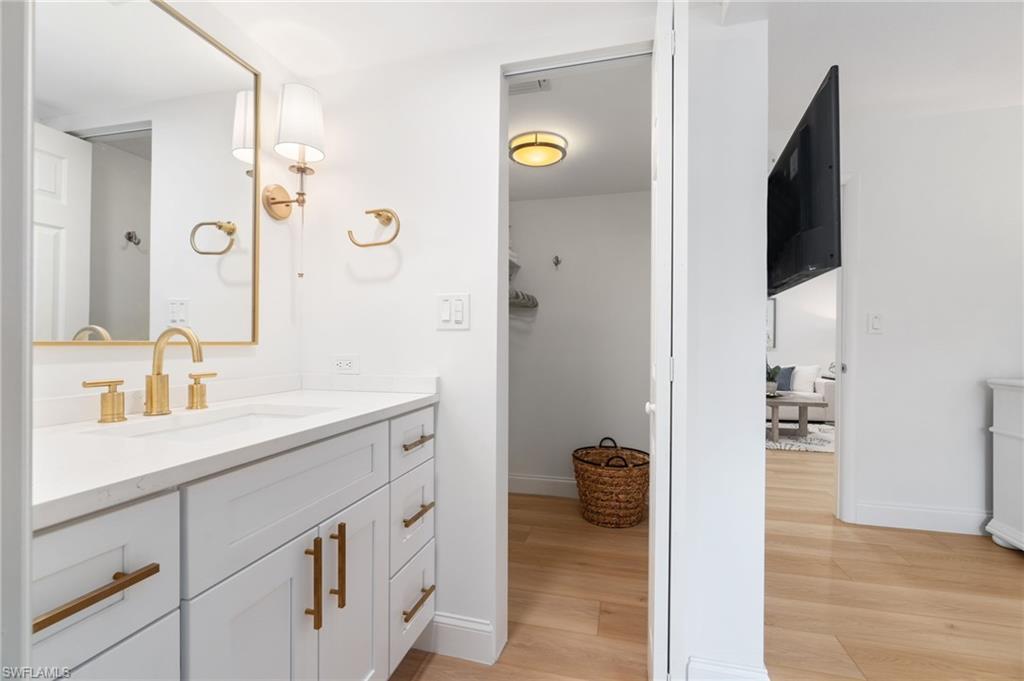 Bathroom featuring vanity and light wood-style flooring