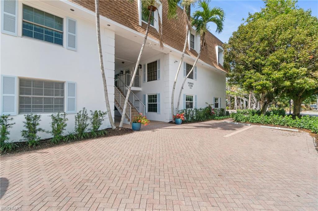 View of property featuring stairway