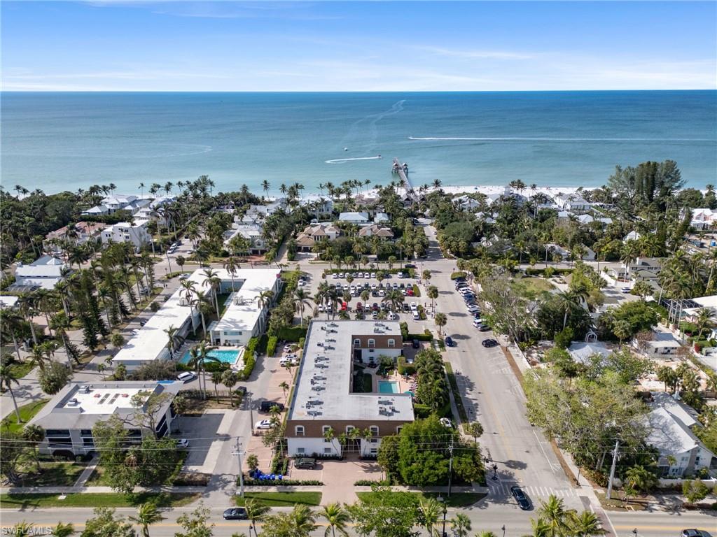 Aerial perspective of suburban area with a nearby body of water