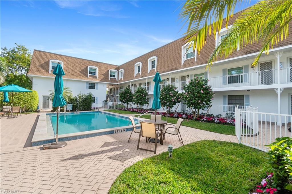 Community pool with a patio area