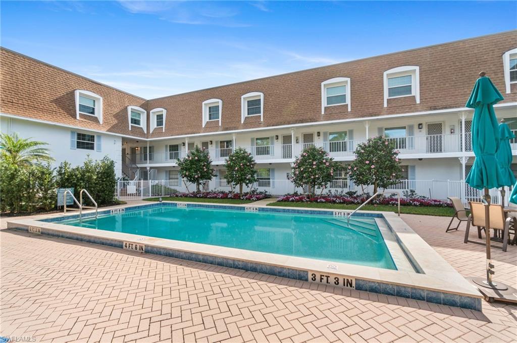 Community pool featuring a patio area