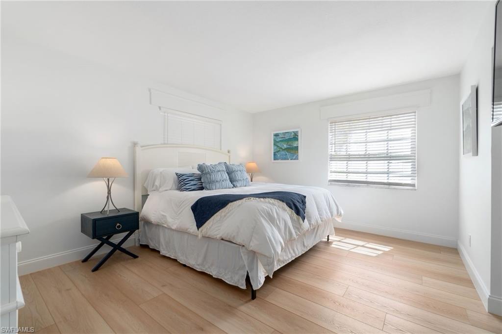 Bedroom featuring light wood-style flooring and baseboards