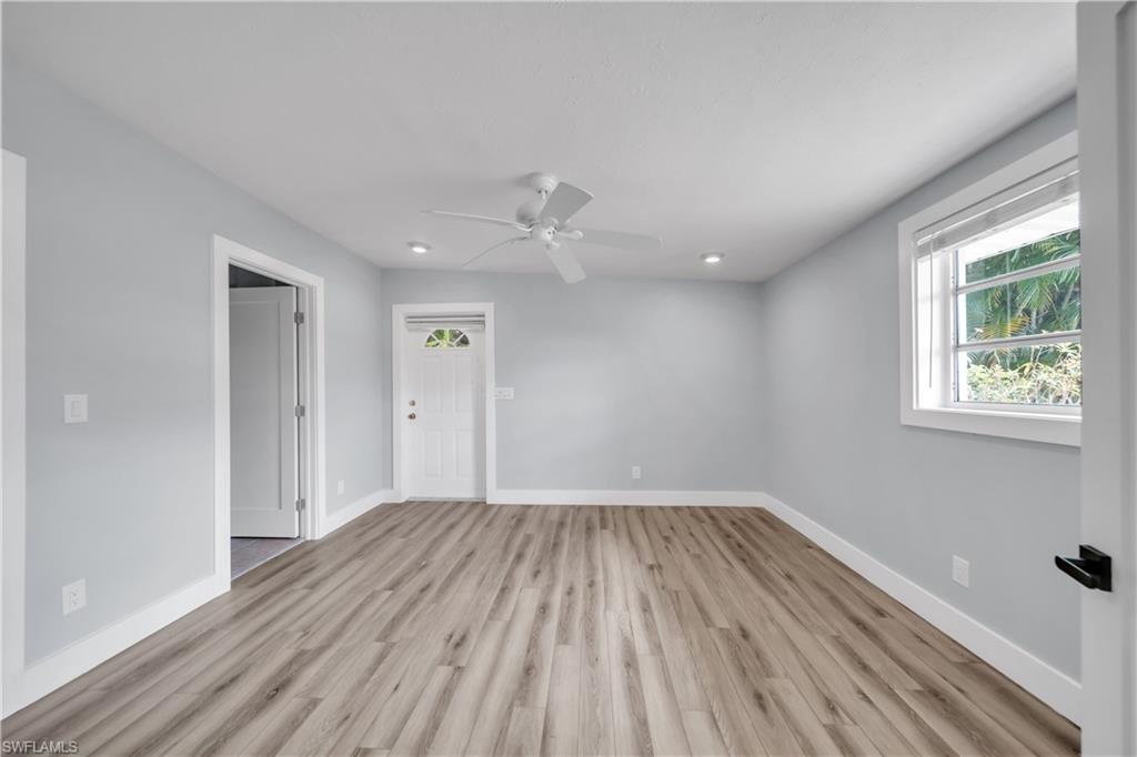 Unfurnished room featuring ceiling fan, light wood-type flooring, and recessed lighting