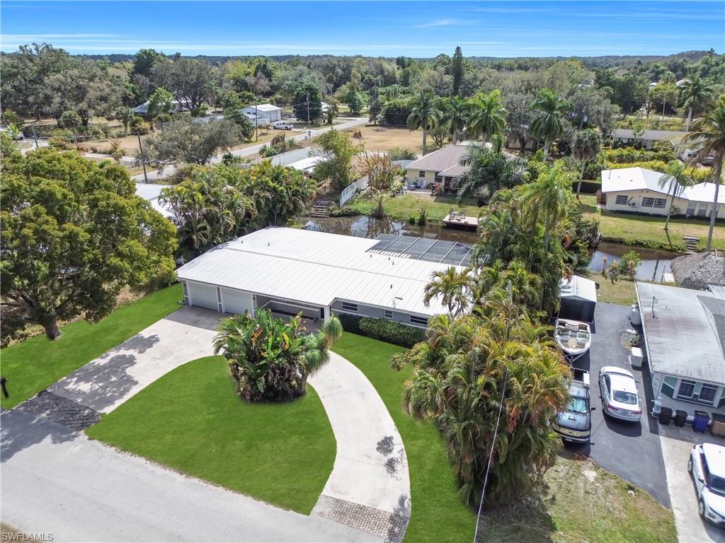 Aerial perspective of suburban area featuring a tree filled landscape