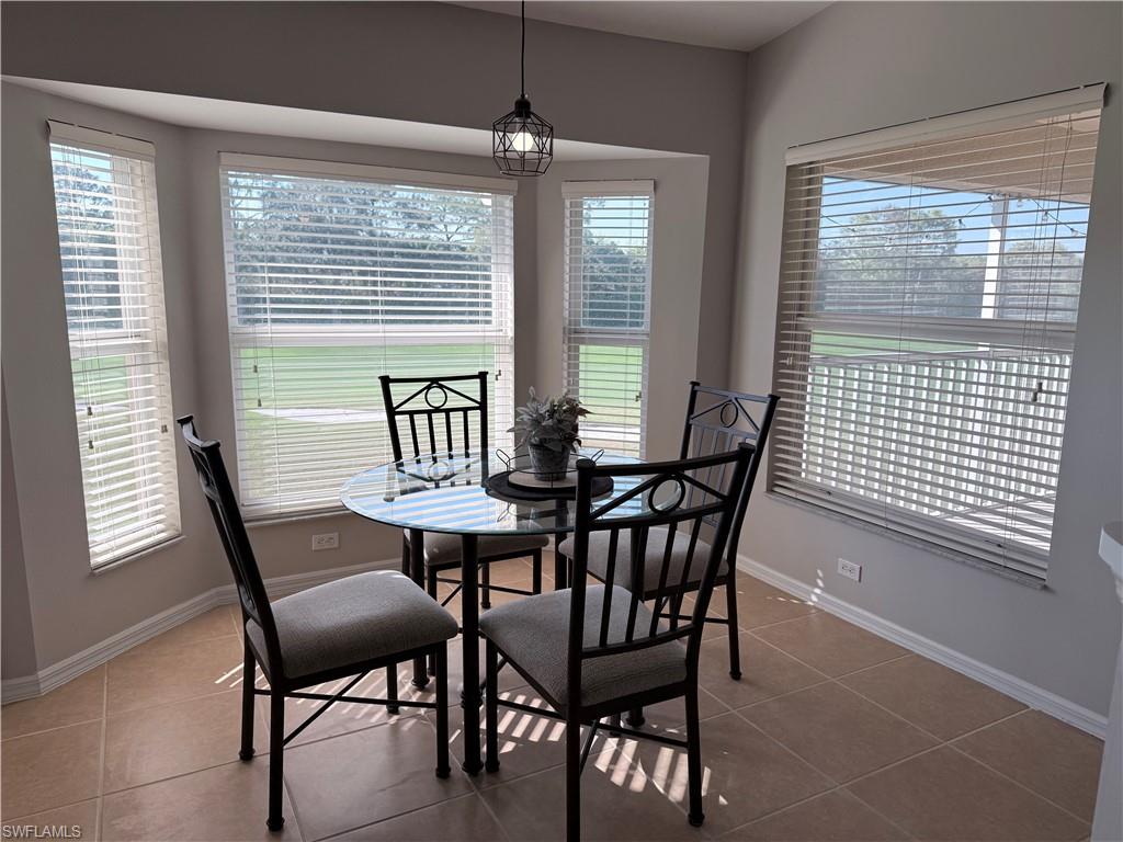 Dining area overlooks hole 14.  Watch as golfers play Cypress Woods.