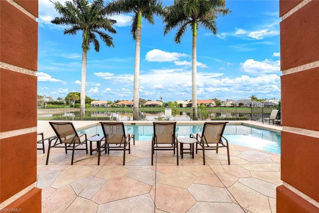 Community pool deck view and patio surround
