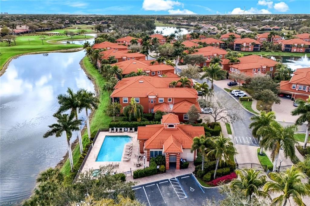 Aerial view of Legacy residential area featuring a nearby body of water and a pool area