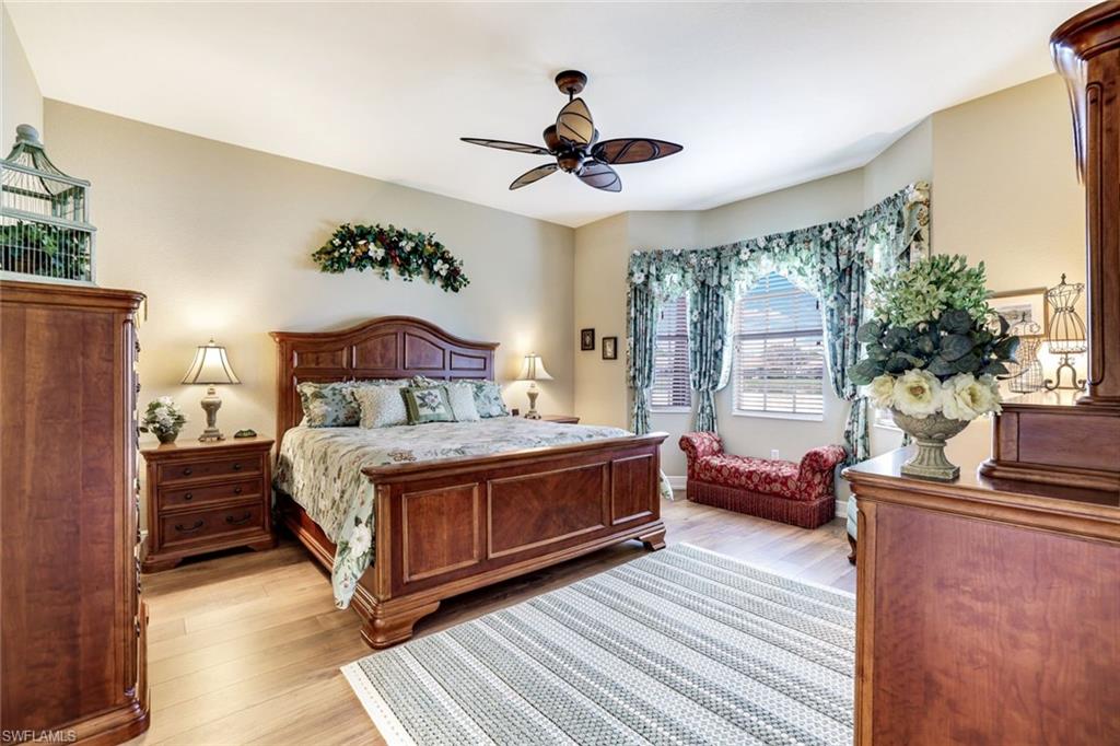 Bedroom with light wood-style floors and ceiling fan