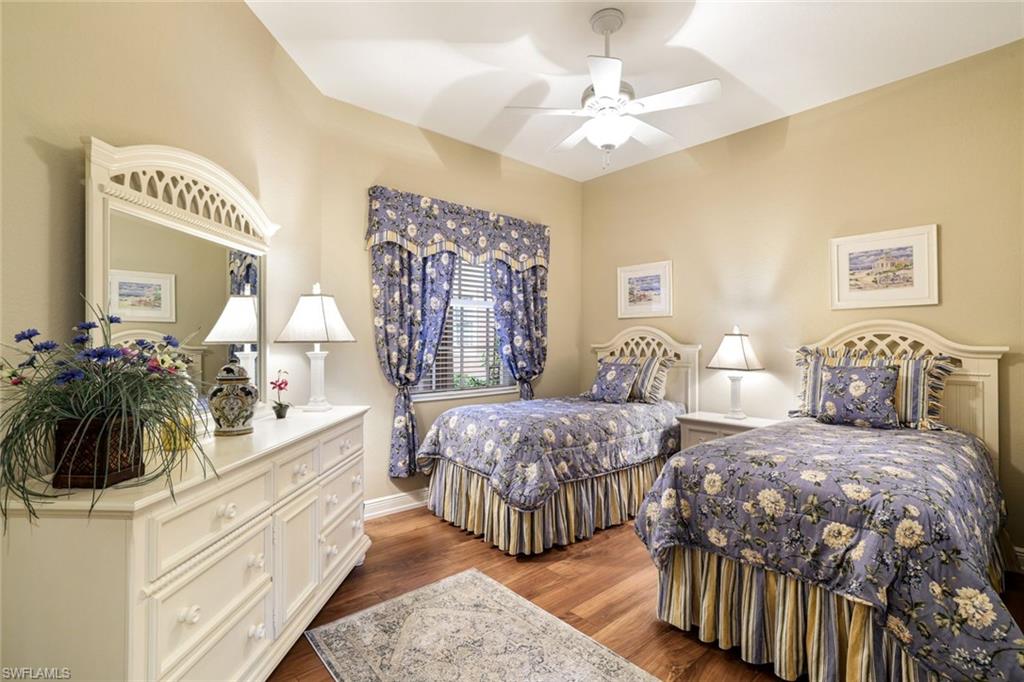 Bedroom featuring dark wood-style flooring and a ceiling fan